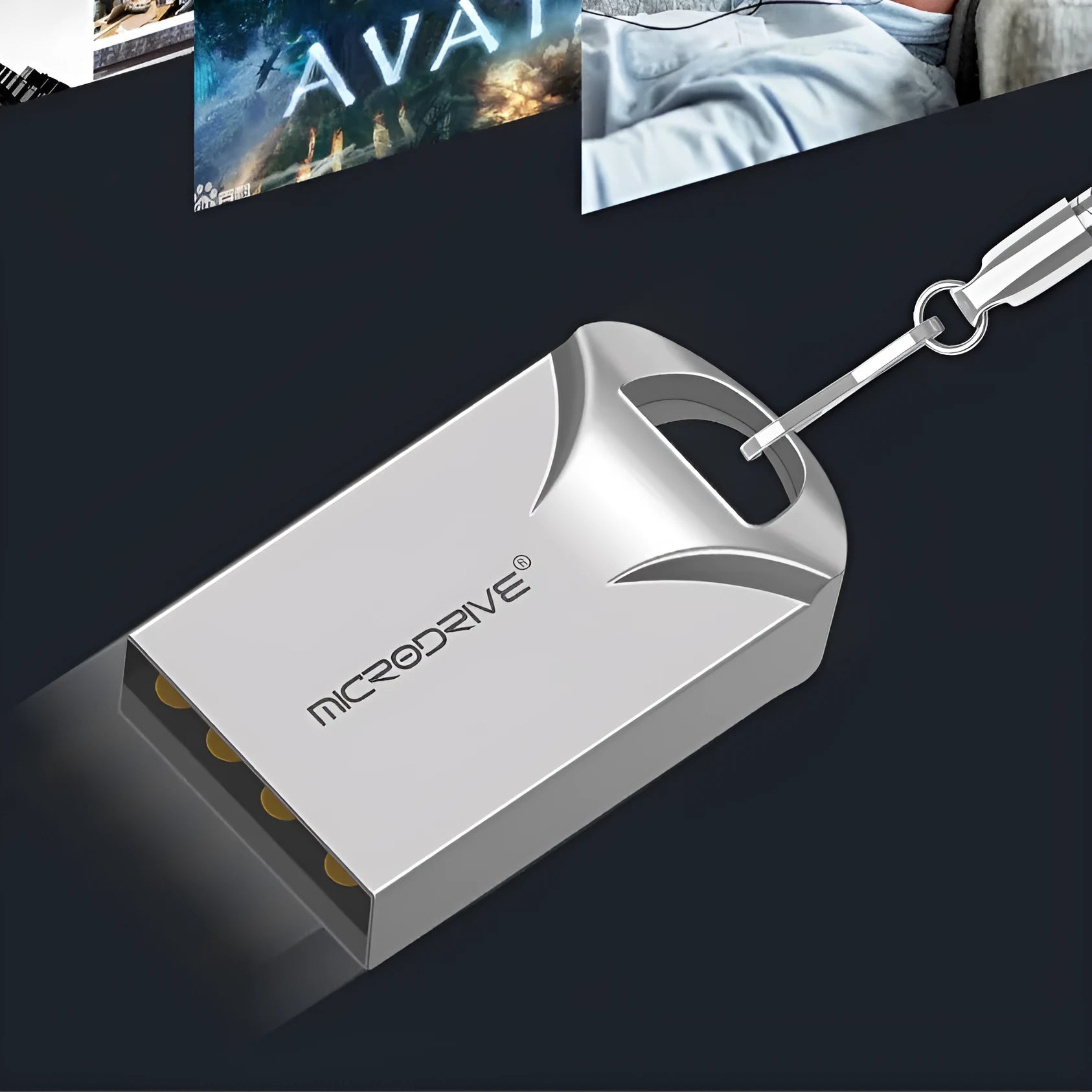 Small silver and black metal USB flash drive on a white background