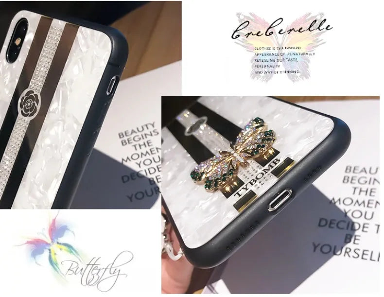Clear acrylic iPhone case with a sparkling butterfly design and a reflective mirror surface.