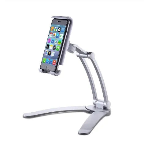 Silver aluminium alloy desktop tablet stand holding a tablet, showing its 360-degree rotation and adjustable chuck mechanism.