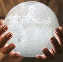 3D printed white moon lamp with detailed craters on a wooden holder, showing touch ring at base.