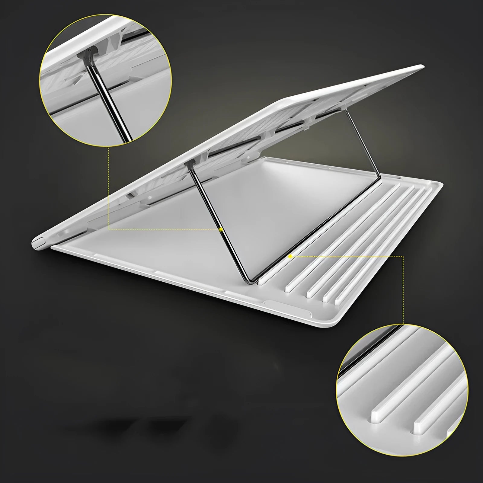 Portable black aluminium notebook stand folded flat next to a laptop