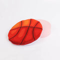 Plush catnip flying disc toy with basketball pattern featuring crinkle sound interior