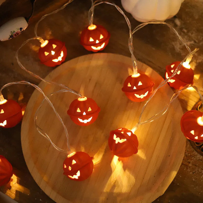 LED Halloween string lights with pumpkin-shaped iron pendants in warm white, 1.65m length with 10 lights displayed on a dark background