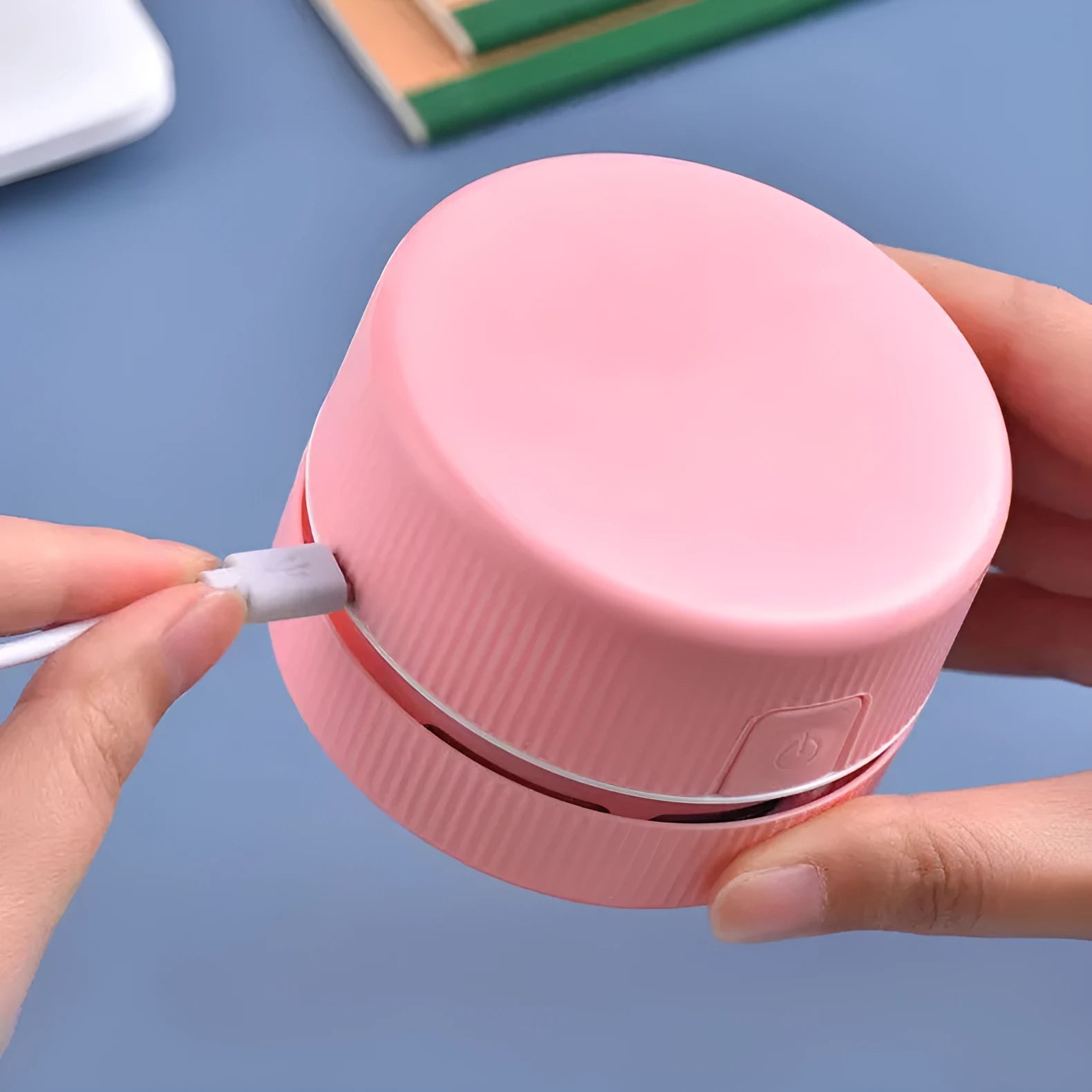 Blue and pink portable mini desktop vacuum cleaner for pencil shavings and small debris