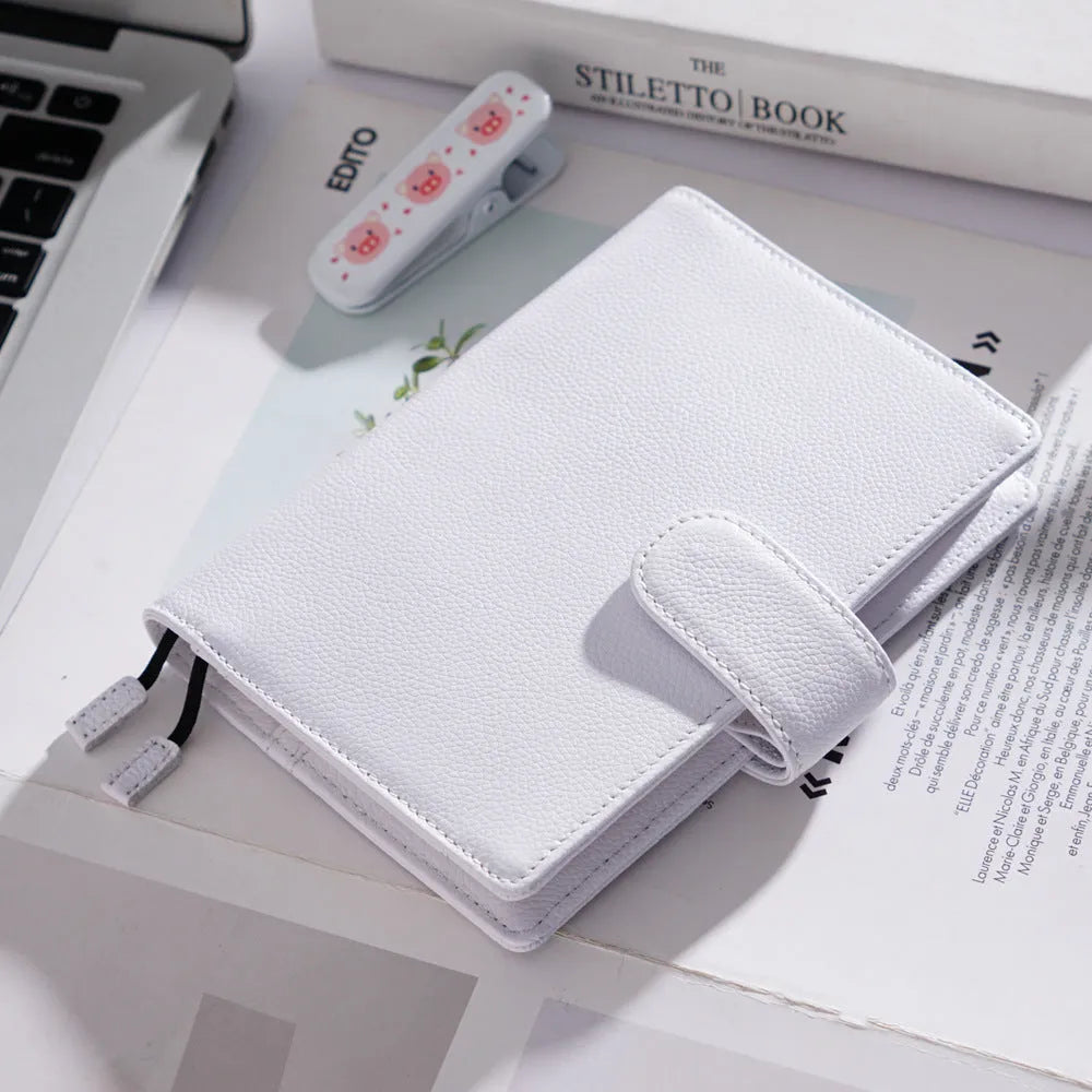 A6 leather notebook with lychee pattern cowhide cover showing loose-leaf binding in three colour options