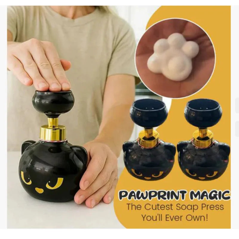 Black plastic cartoon cat-shaped soap extrusion dispenser accessory on countertop
