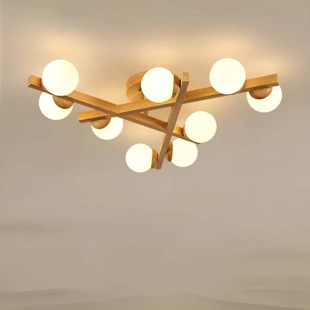 Modern Nordic-style ceiling light with wooden accents and three white lamp heads mounted on a clean, white ceiling.