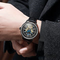 Men's stainless steel mechanical watch with a round dial, mineral glass, and a butterfly clasp, shown on wrist.