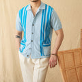 Man wearing a royal blue striped short-sleeved knitted polo cardigan with a lapel collar.