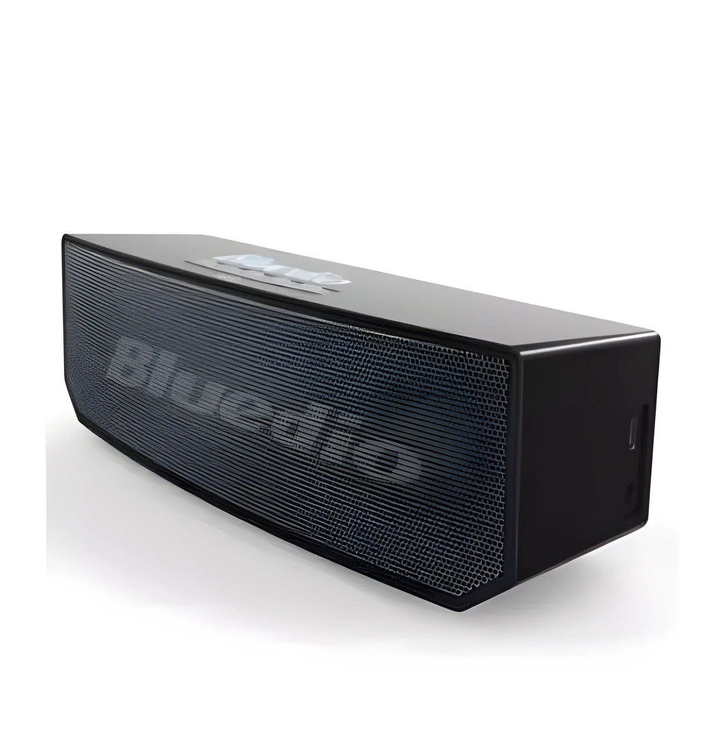 Black BS-6 Google Assistant Bluetooth smart speaker on a surface, showing its compact rectangular design.