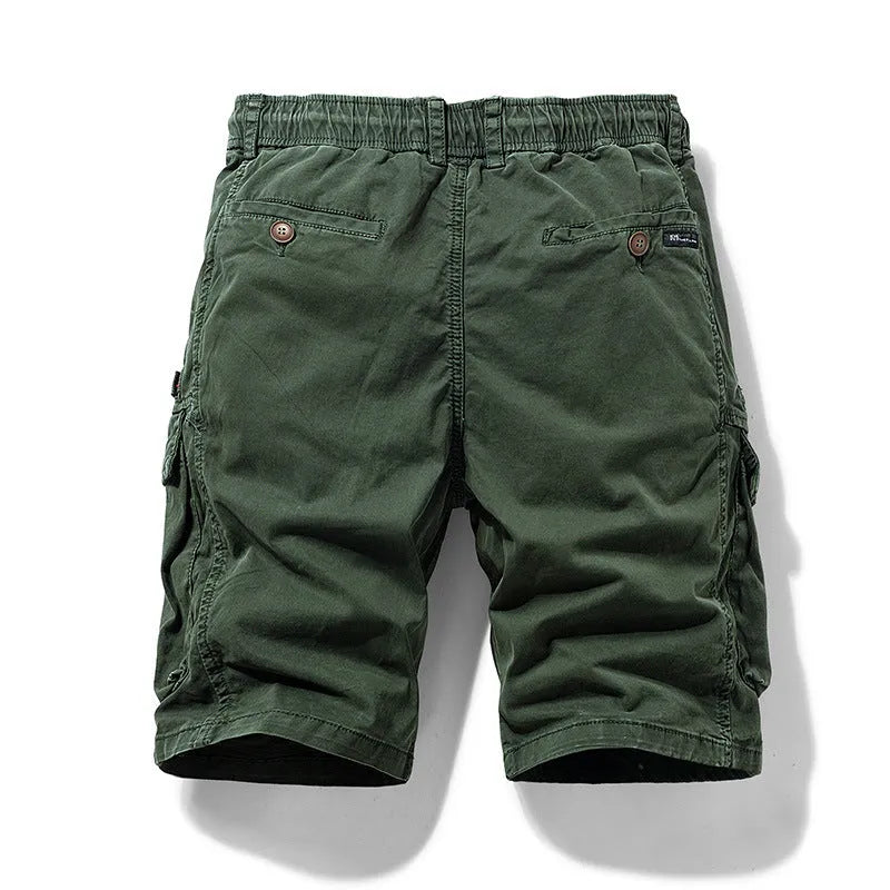 Men's army green cotton shorts with zipper fly and multiple pockets, showing Korean style fit.
