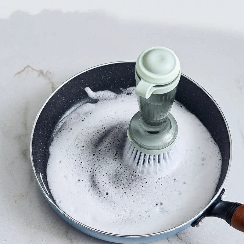 Milk white and mint green kitchen dish brush with soap dispenser and replaceable non-scratch head.