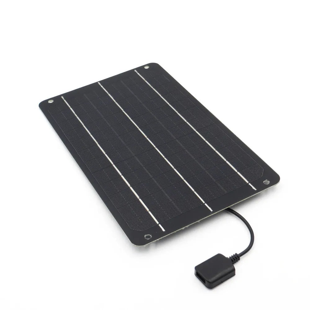 Portable solar panel unit with a small fan and a USB charging port for mobile phones.