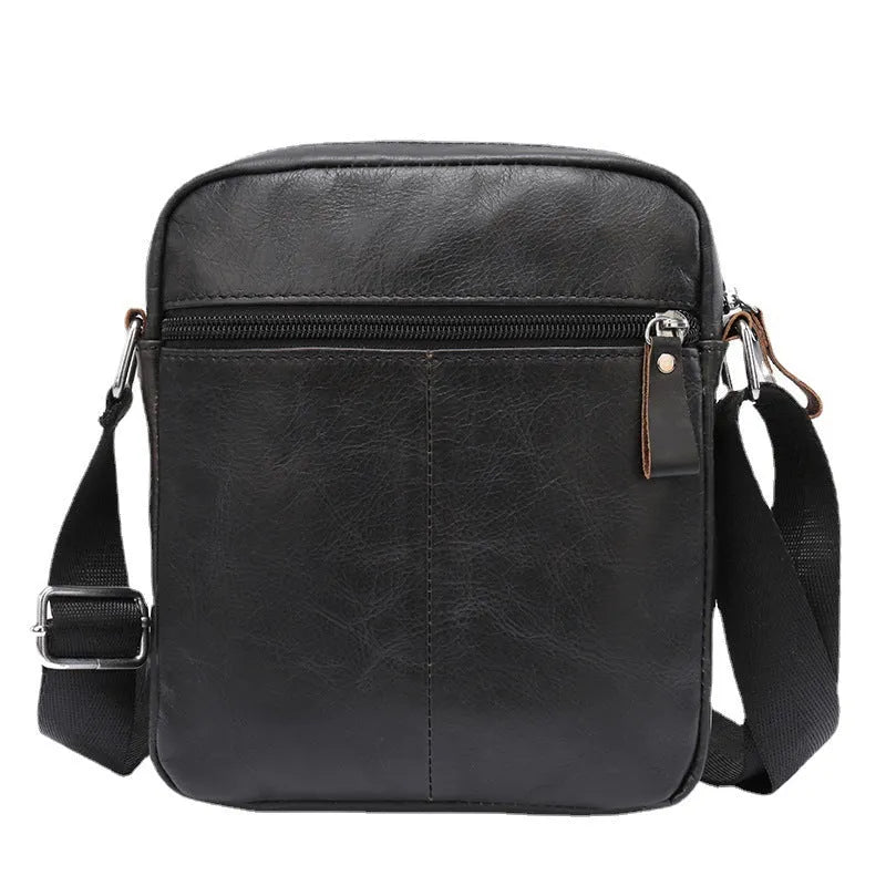 Black leather messenger bag with crossbody strap and visible sewing lines