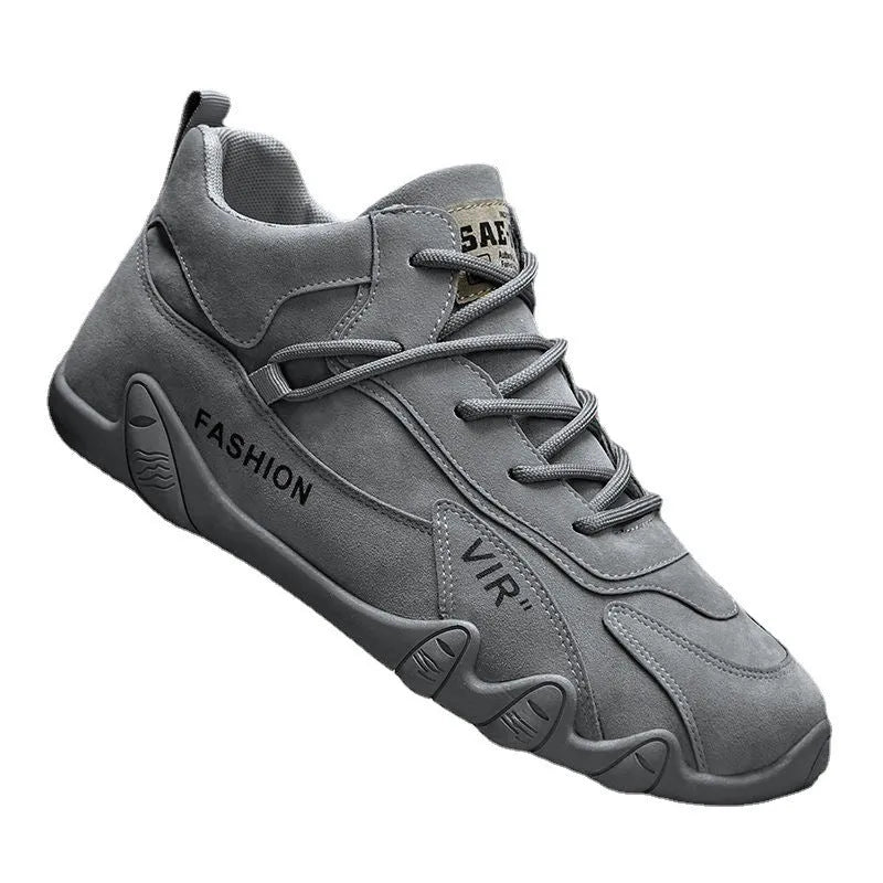 Men's grey low-cut casual shoe with elastic band and synthetic leather upper on a non-slip sole.