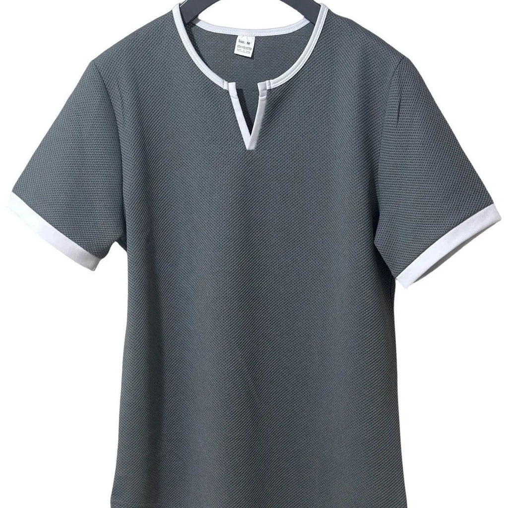 Colour-block waffle textured V-neck sports t-shirt in polyester on a size chart.