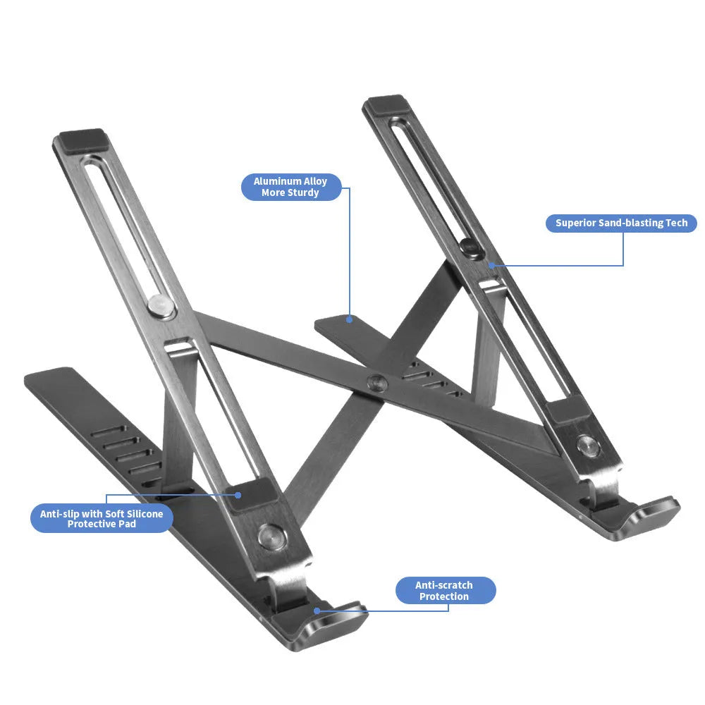 Silver aluminium laptop stand open at an angle next to a closed laptop.