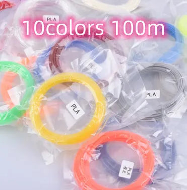 Yellow 3D printing pen with 12 colour PLA filament spools and UK power adapter on a white background
