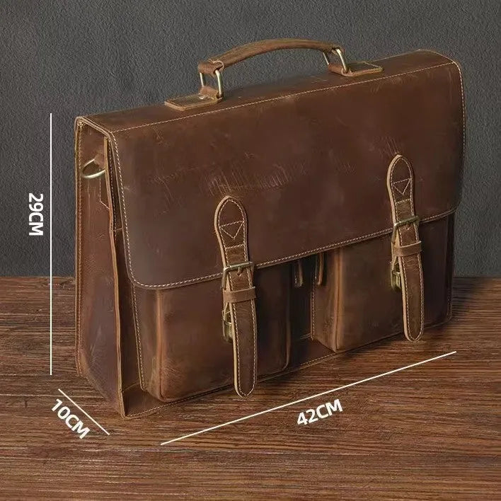 Top cowhide leather computer bag in dark brown with crossbody strap and sewing line detailing