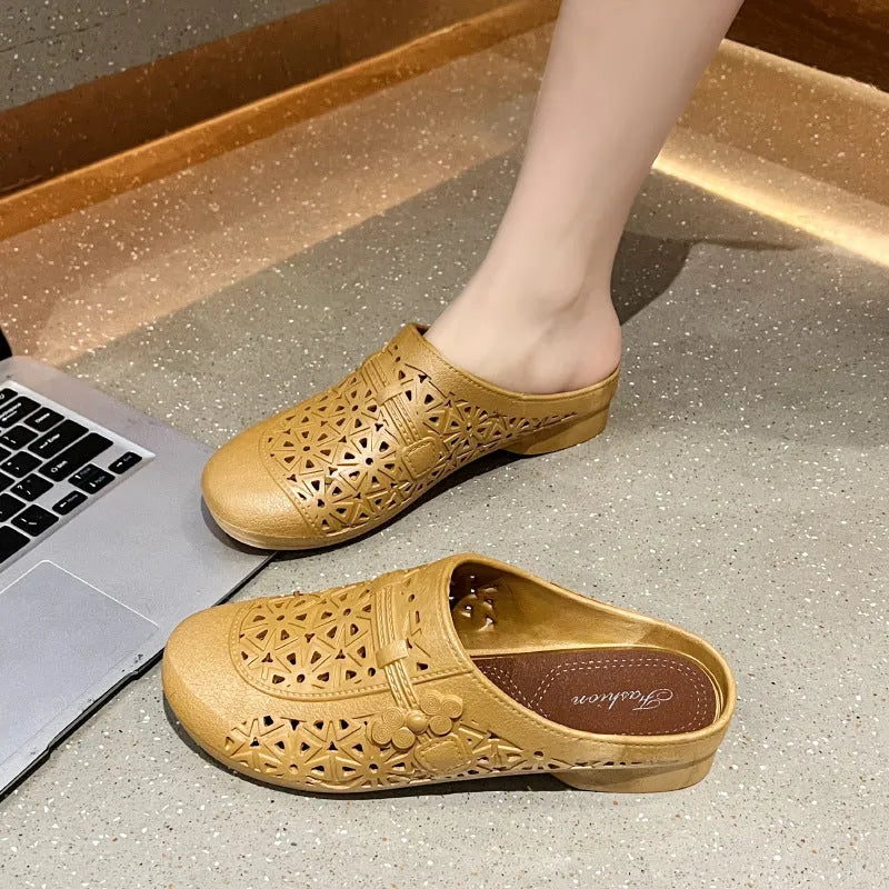 Flat toe box PVC fairy style half slippers in apricot colour on a plain background.