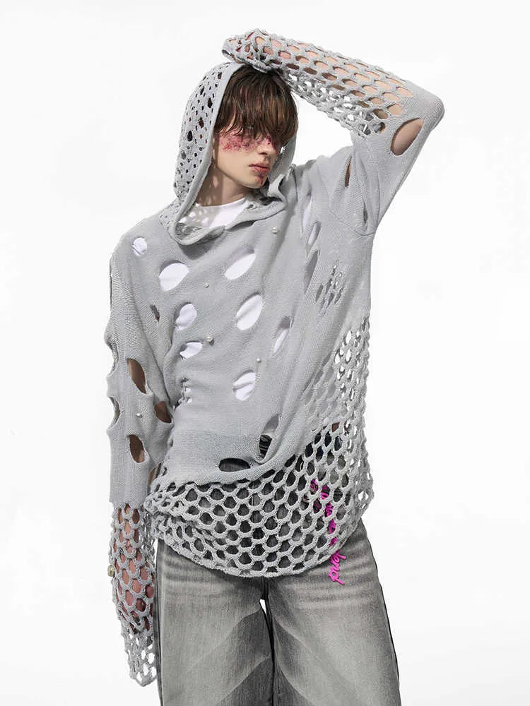Black loose-fit men's pullover hoodie with a hood and pearl decorative detail on the front.
