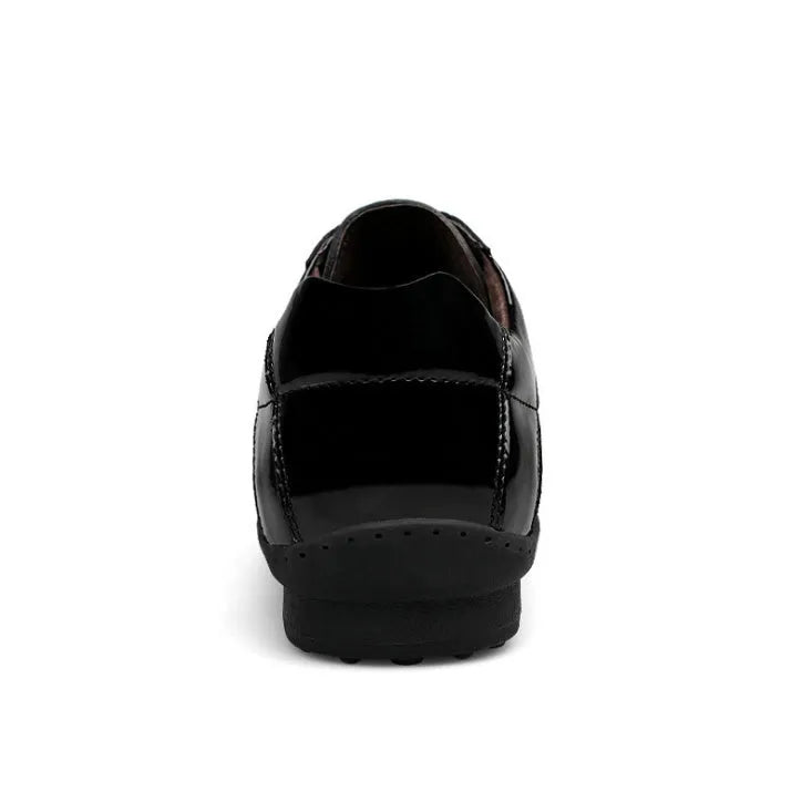 Genuine leather casual men's shoes in black with lace-up closure on a plain background