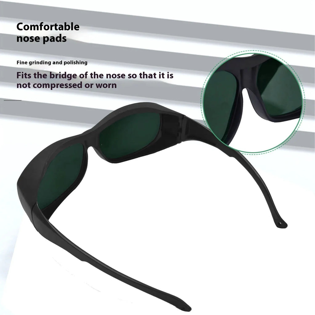 A pair of clear PC laser safety goggles for skin rejuvenation and welding, offering 200-2000nm wavelength protection.