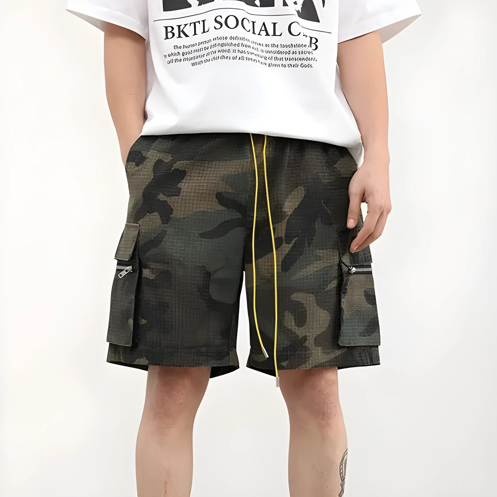 Men's camouflage work shorts with multiple pockets showing cropped length and mid-waist design