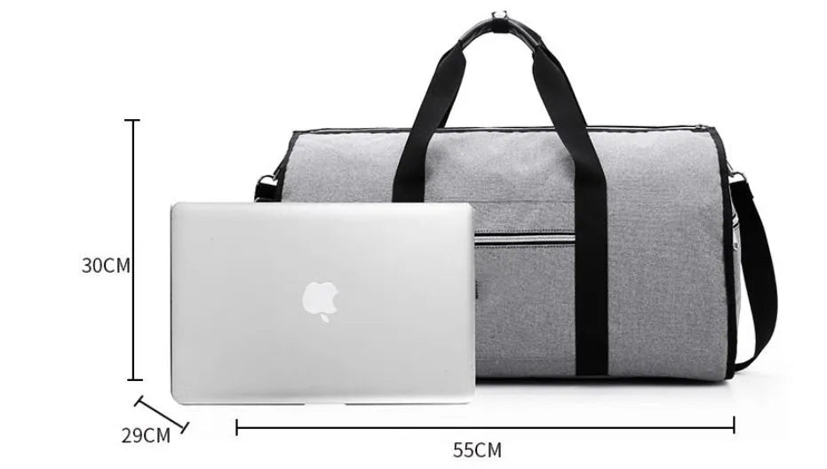 Medium sized cylinder travel bag in black Oxford cloth, showing zipper opening and internal pocket.