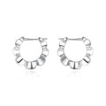 A pair of sterling silver retro geometric earrings with round elements and an electroplated finish.