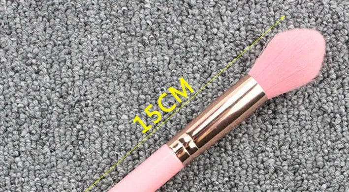 Pink blush brush with corrugated silk nylon wool bristles and plastic handle for highlight application