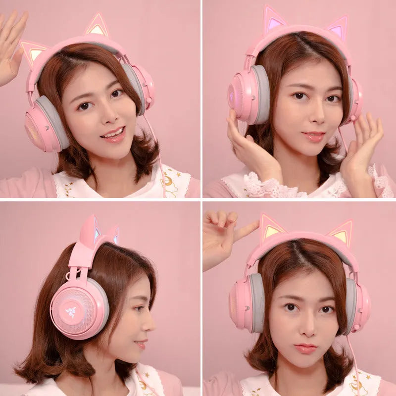 Pink glowing cat earphones wired USB headphones with LED cat ear lights on a plain background
