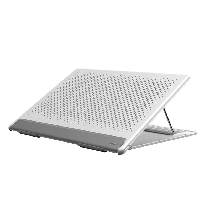Portable black aluminium notebook stand folded flat next to a laptop