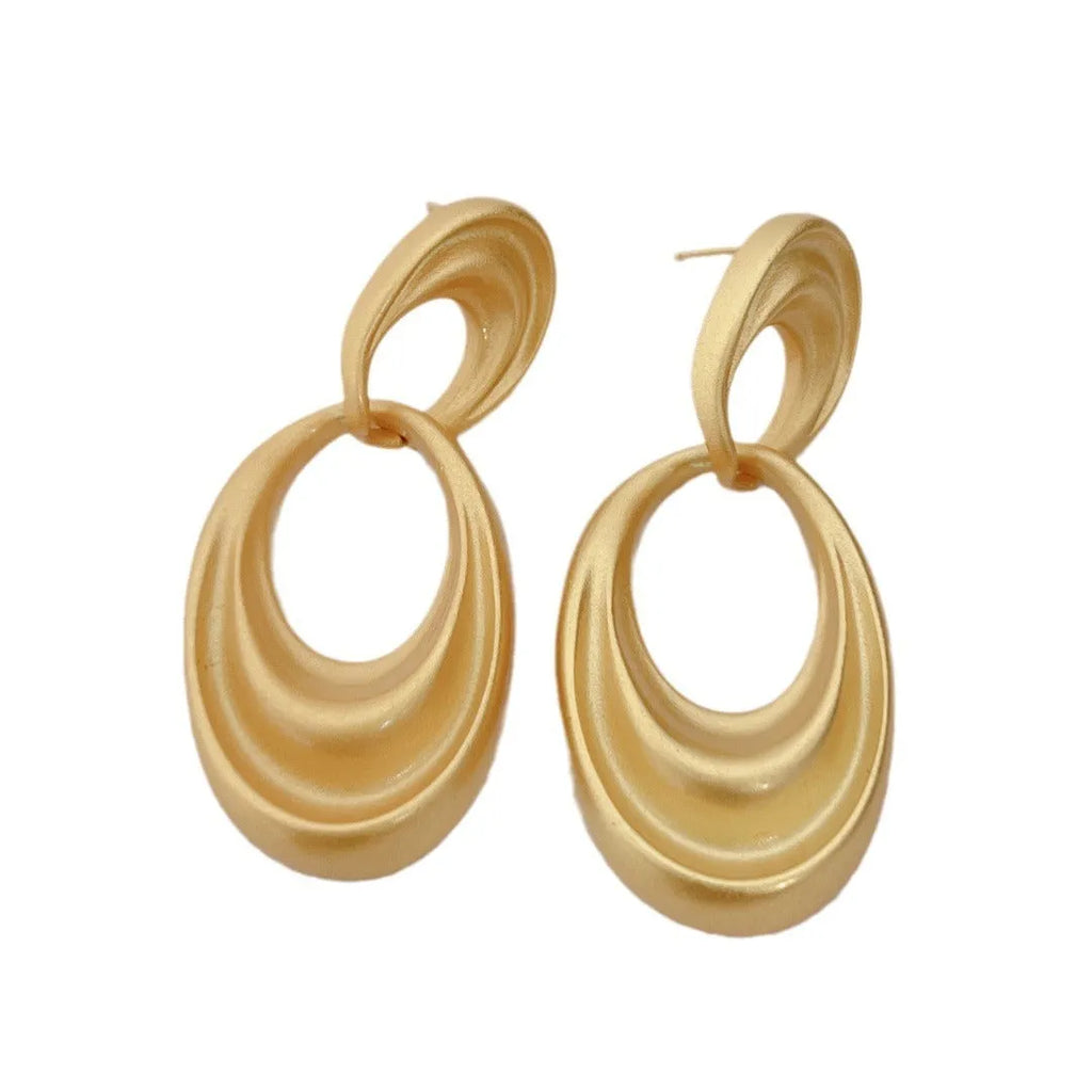 Gold French retro earrings with double circle design on U-shaped copper hoops