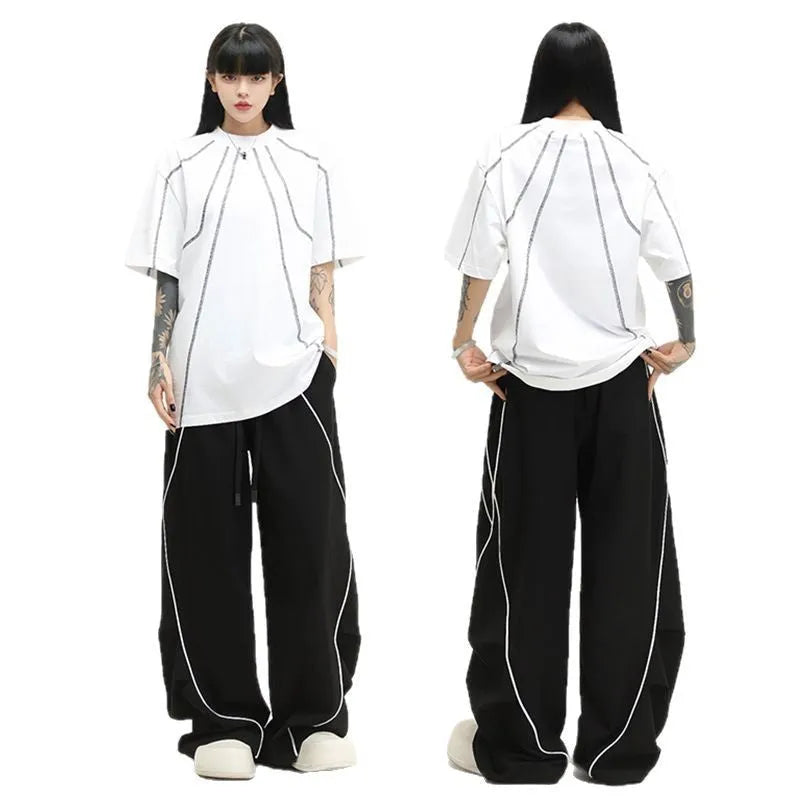 Black striped hip hop trousers with pleated wide-leg design for dance and casual wear