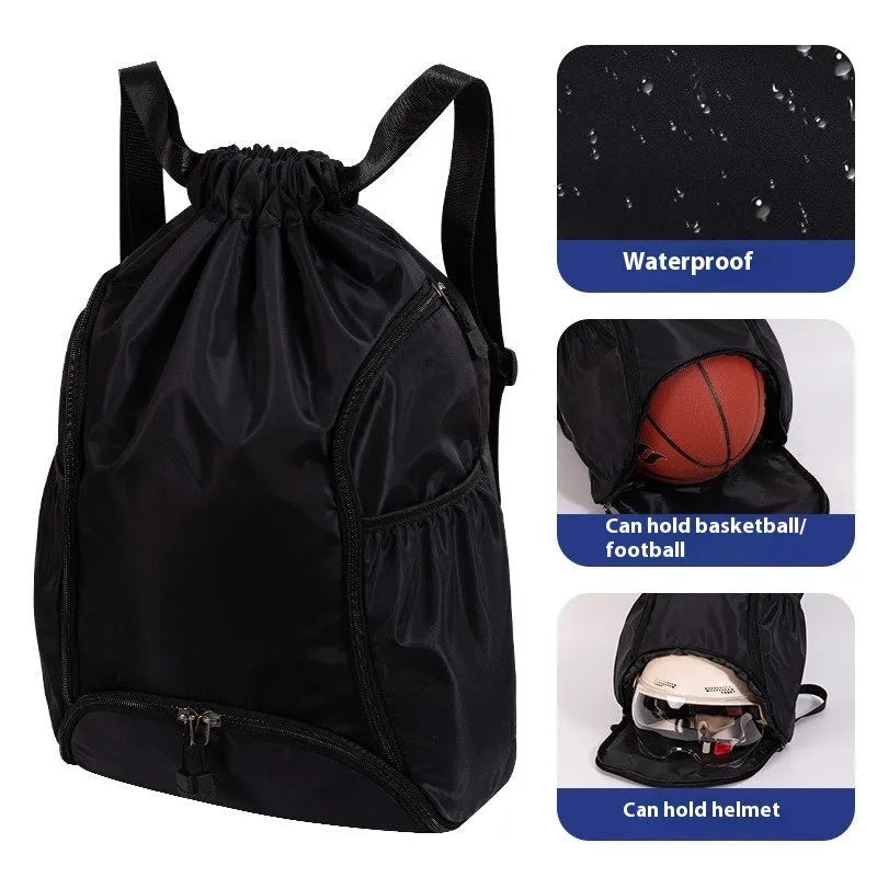 Large black cube-shaped sports backpack with a drawstring top closure, shown on a neutral background.