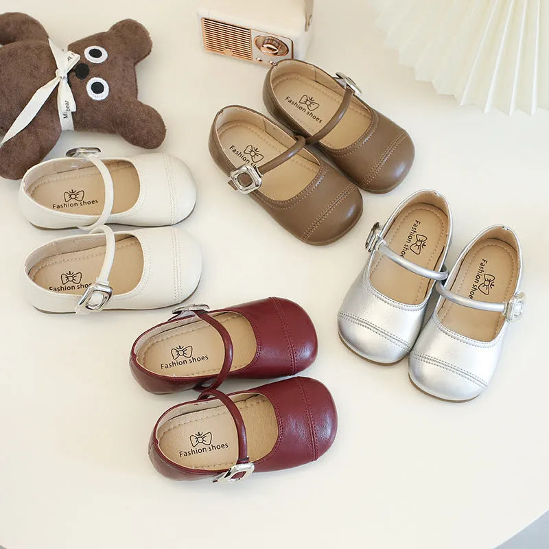 Girls PU leather Mary Jane shoes in solid beige colour with single strap, size 35, side view
