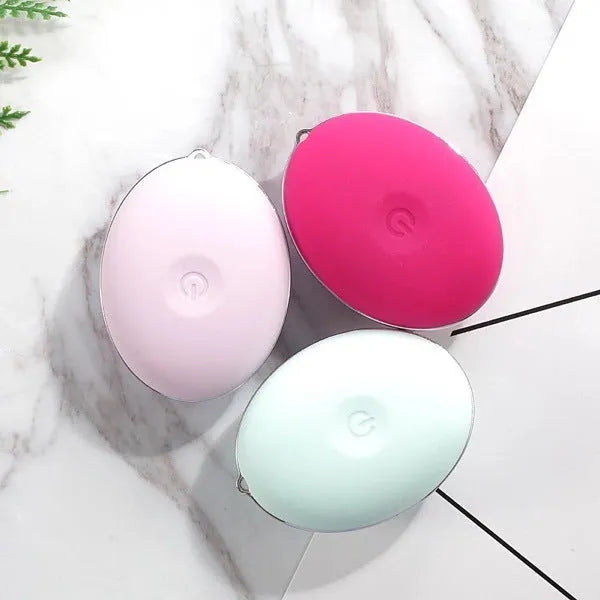 Ultrasonic electric face wash brush in pink with silicone brush head, compact design for deep pore cleansing
