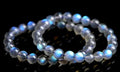 Blue Moonlight quartz bracelet with natural cream body beads on a white background.