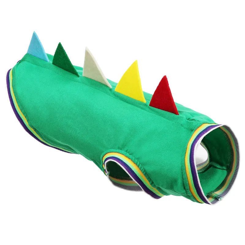 Green cotton dog vest with dinosaur print for small sausage dog, side view, outdoor setting