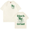 Loose fit men's linen t-shirt in a solid colour with a printed Rise And Grind cartoon graphic on the front.