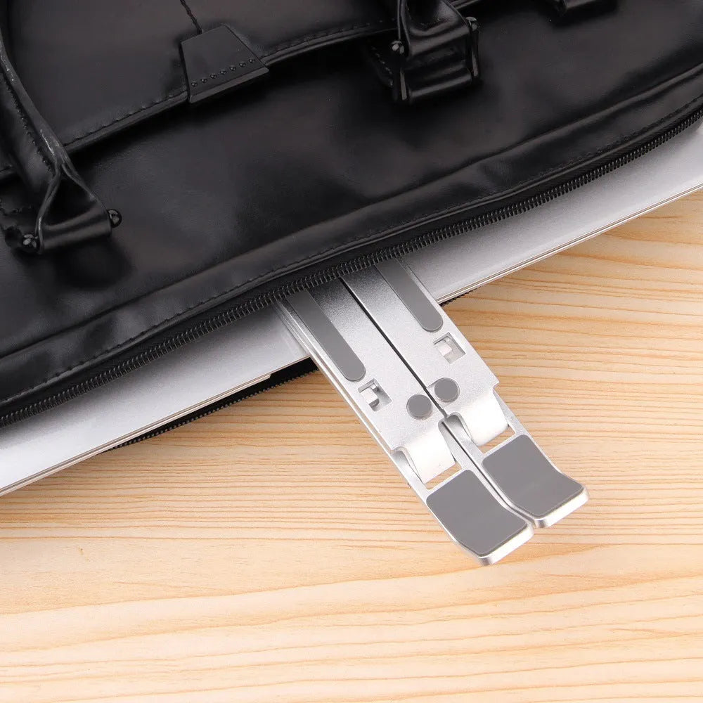 Silver cooling folding computer stand made of aluminium alloy and silicone pads for laptops under 16 inches