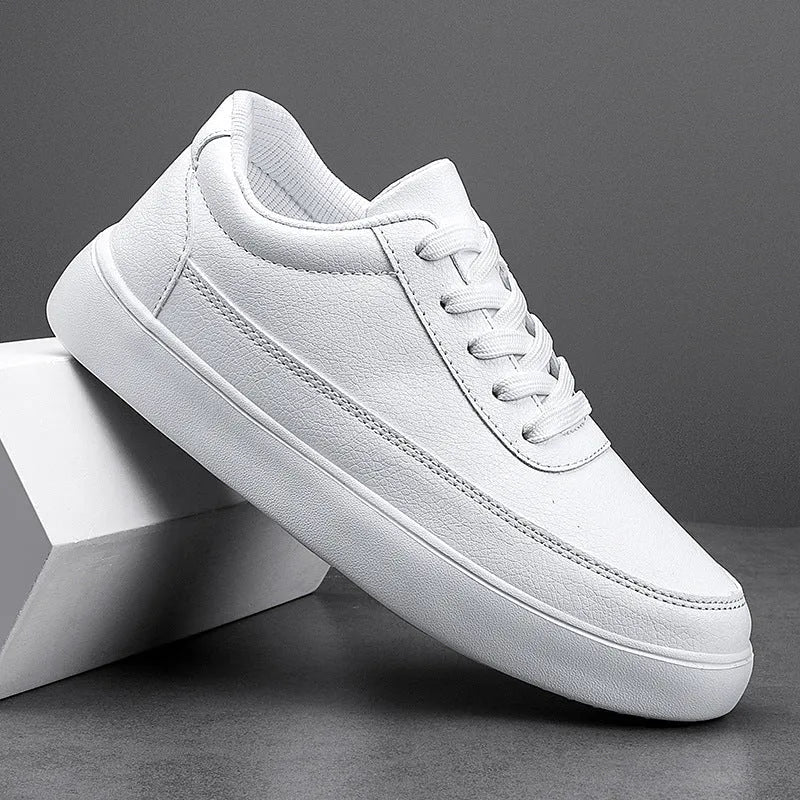 Women's white leather casual flat lace-up shoes on a neutral background, showing front and side views.