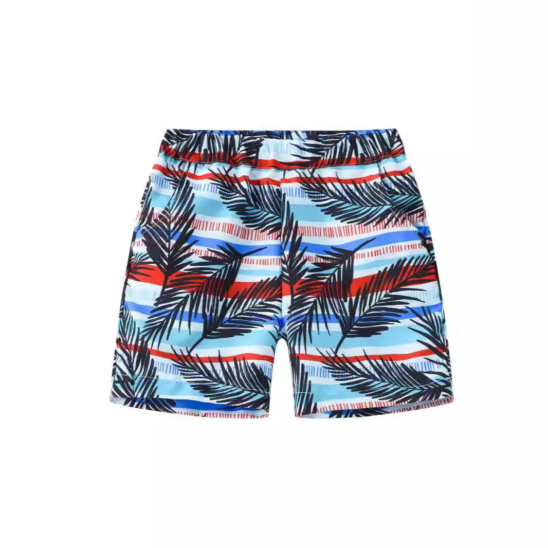 Multi-colour printed beach shorts with elastic waist for children on a summer background