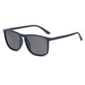 Sports driving polarized sunglasses with black frame and black grey TAC lens on reflective surface