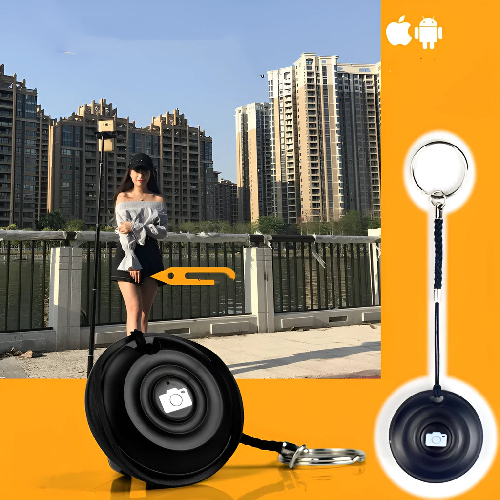 Small black Bluetooth selfie remote on a palm, showcasing its compact size and single button.