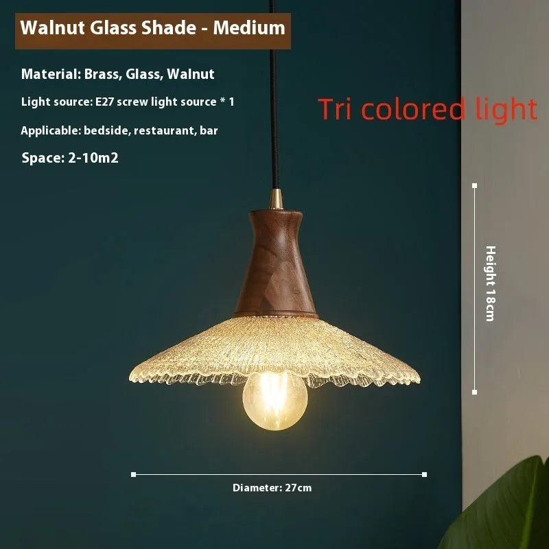 Brass and glass wooden chandelier ceiling light with clear shades in three available sizes.
