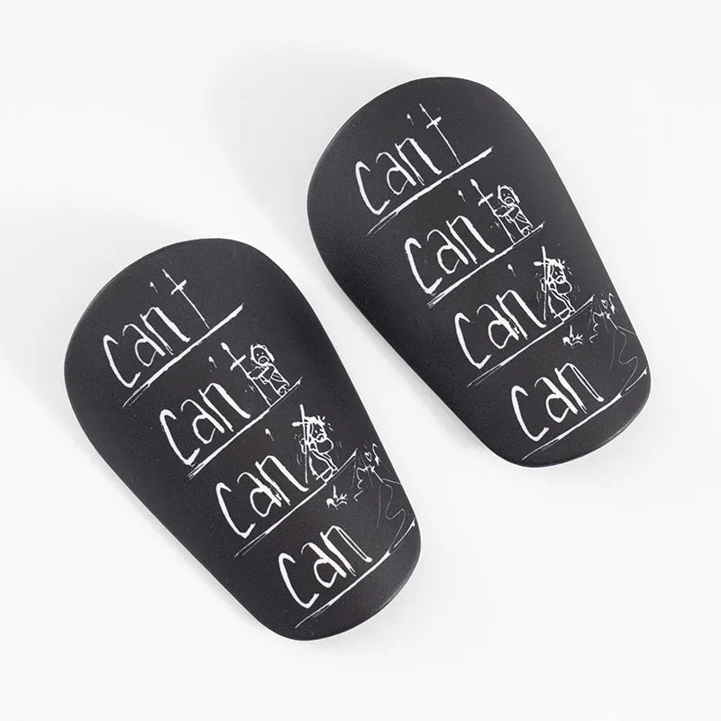 A pair of PU football shin guards in blue, shown on a leg, with S and XS sizes available.