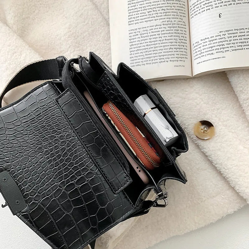 Vintage PU leather crossbody bag shown in black, dimensions 20cm by 14cm.