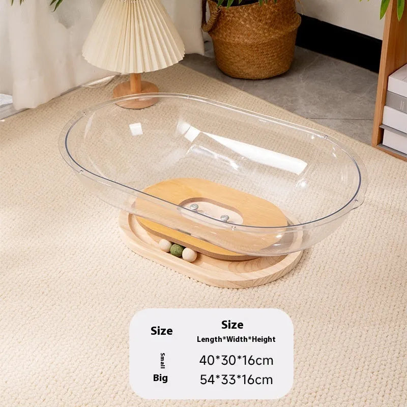 Transparent acrylic space capsule-shaped cat bed on a turntable base.